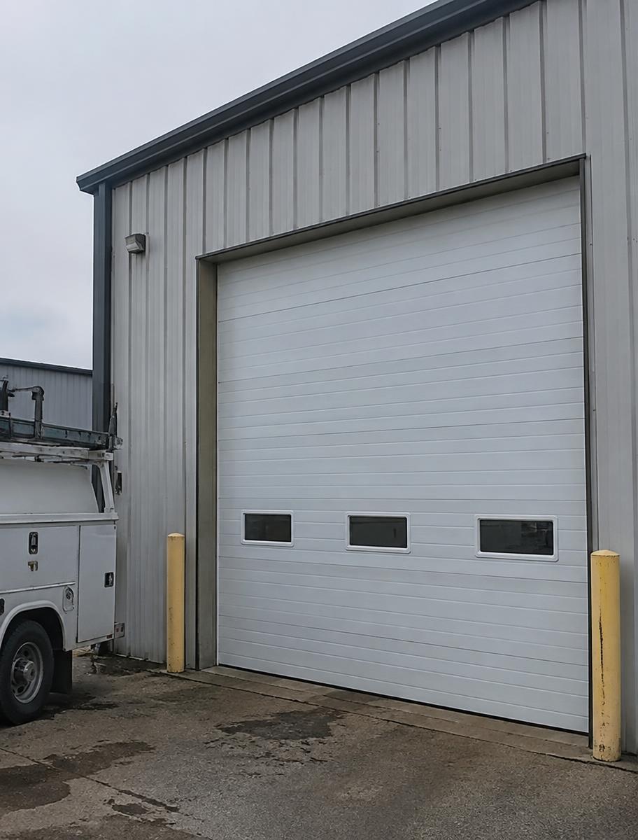 Steel commercial overhead door on a warehouse loading bay